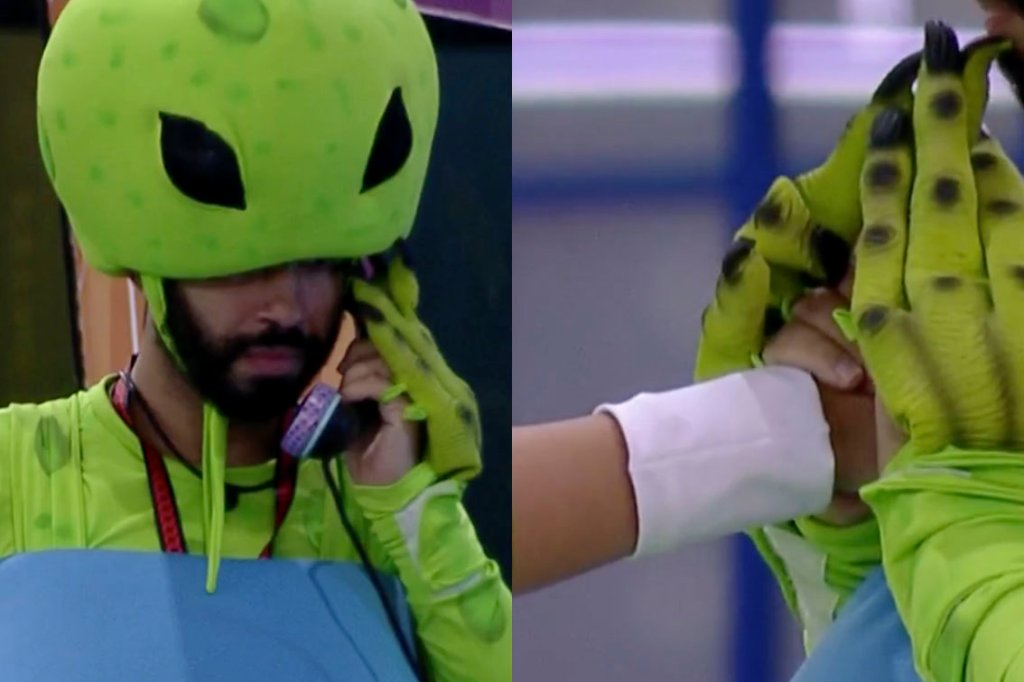 Gilberto vestido de ET, como castigo do monstro no BBB21, atendendo o Bigfone