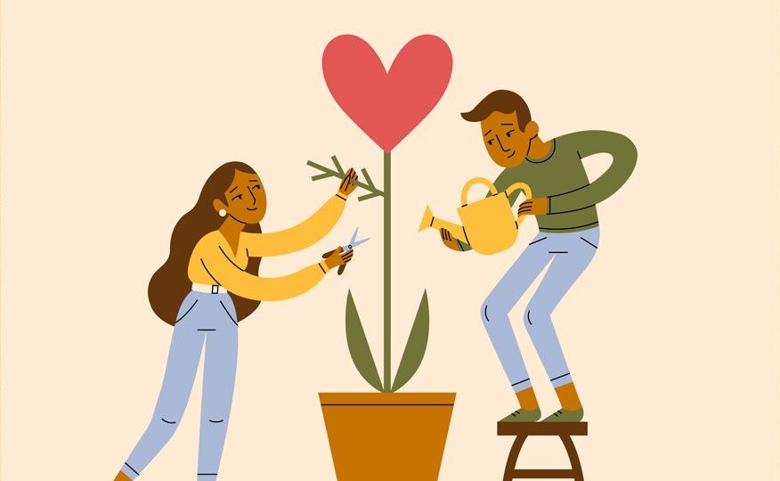 Ilustração de um casal regando uma plantinha, que na verdade é um coração vermelho. É uma metáfora para o amor. Tanto a mulher quanto o homem são morenos e têm cabelo castanho. Eles usam calça jeans e blusas de manga comprida.