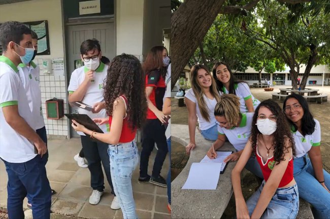 Jovem de 18 anos, de cabelo cacheado e óculos de grau, coleta assinaturas para a campanha Amazônia de Pé